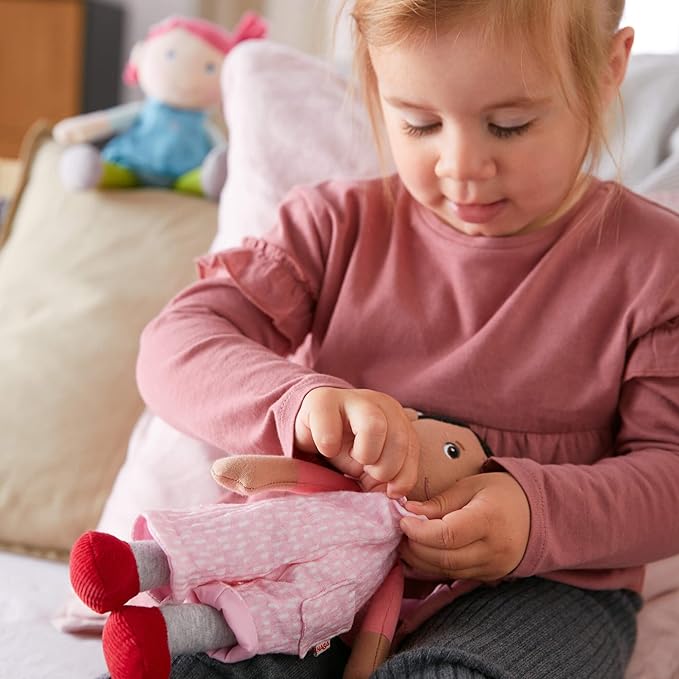 HABA Snug Up Doll Rumbi - 10" Soft Doll with Black Hair and Pink Overalls - Machine Washable for 18 Months and Up