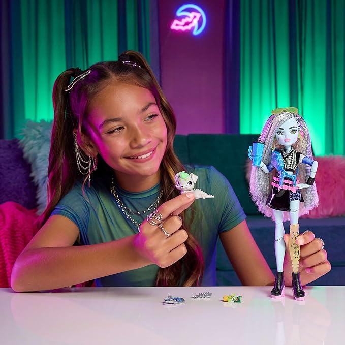 Monster High Doll, Frankie Stein in Cropped Sweater and Black Pleather Skirt with Pet Dog Watzie and 7 Accessories Like Earphones, Belt Bag and Snacks