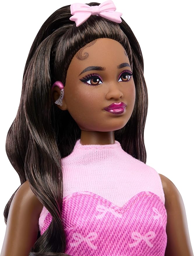 Barbie Deluxe Style Doll #10 in Pink Denim Top and Skirt Set with Bow Print, Black Hair, Behind-the-Ear Hearing Aids and Accessories Like Handbag