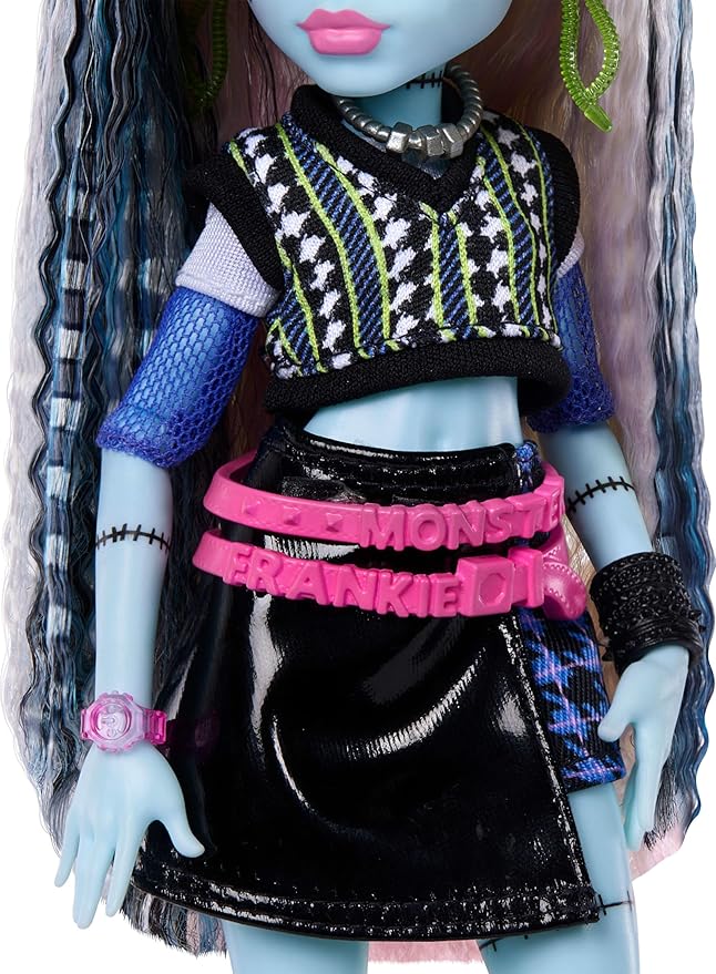 Monster High Doll, Frankie Stein in Cropped Sweater and Black Pleather Skirt with Pet Dog Watzie and 7 Accessories Like Earphones, Belt Bag and Snacks