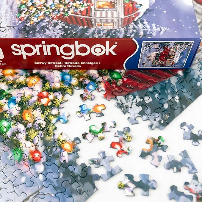 Springbok's Snowy Retreat 1000 Piece Jigsaw Puzzle is a Fun Holiday Image Featuring a Camper Glowing in Holiday Decor