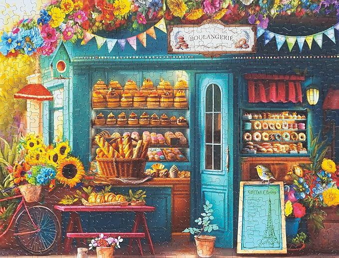 Springbok's Boulangerie Pastry Shop 500 Piece Jigsaw Puzzle for Adults Will Have Your Wishing for Pasteries in This Colorful Scene of Baked Goods and Flowers.