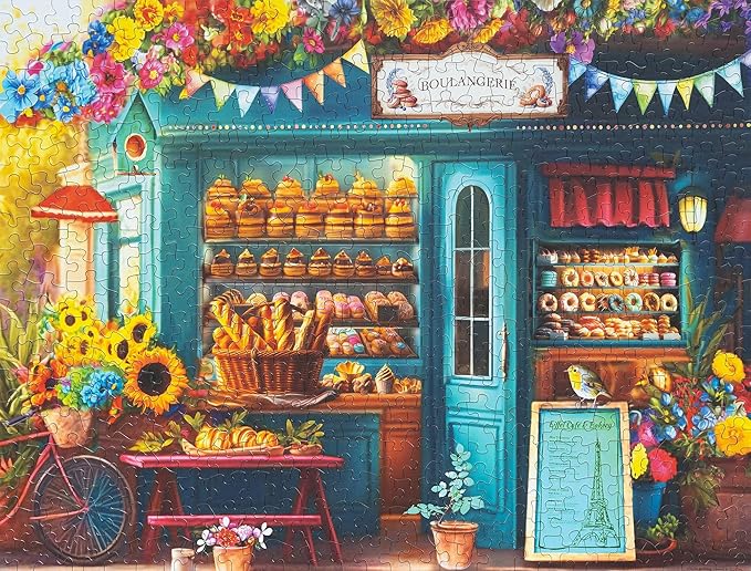 Springbok's Boulangerie Pastry Shop 500 Piece Jigsaw Puzzle for Adults Will Have Your Wishing for Pasteries in This Colorful Scene of Baked Goods and Flowers.